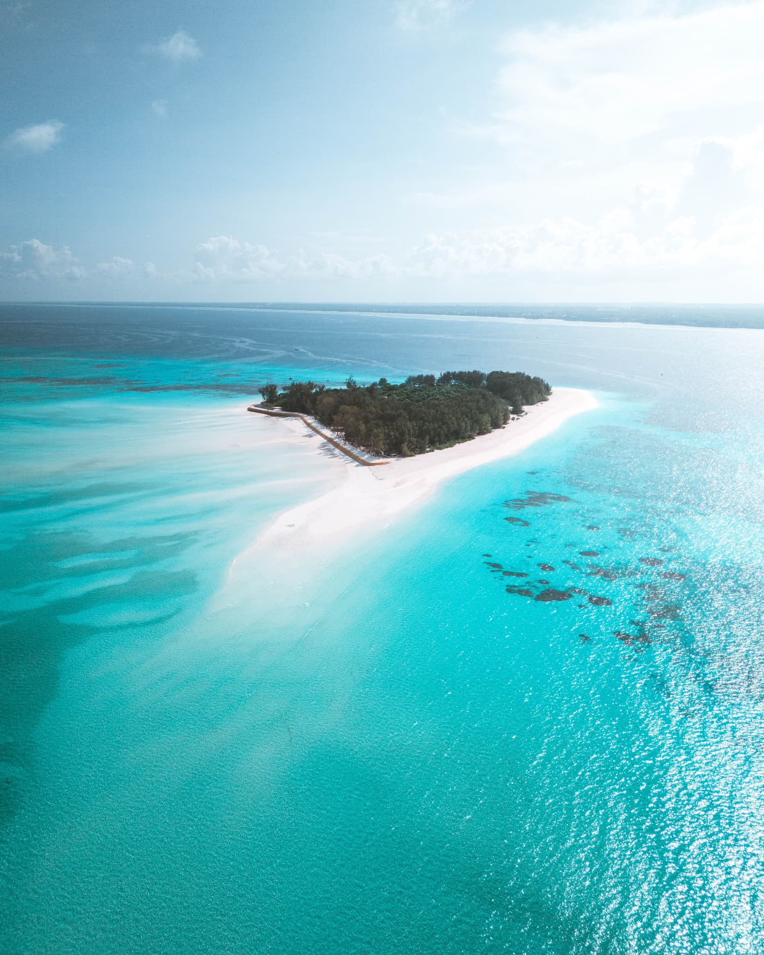 Turquoise reef and sandbank off the Zanzibar coast seen from the air